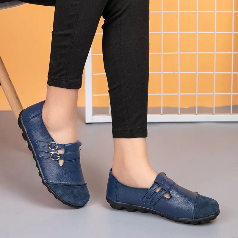 Casual low top flat shoes with Velcro strap in cow split leather, available in multiple colours.