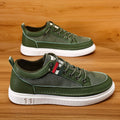 Men's black high-top canvas sneakers with a round toe and PU upper on a white background