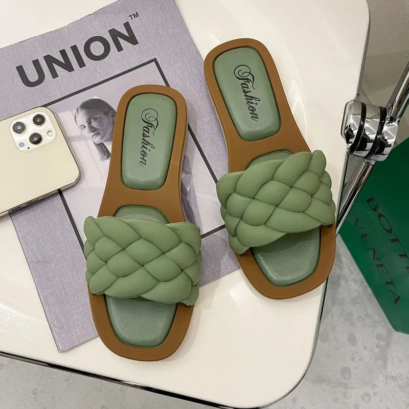 Women's PVC beach sandals with a thick non-slip sole in black, shown on a white background.