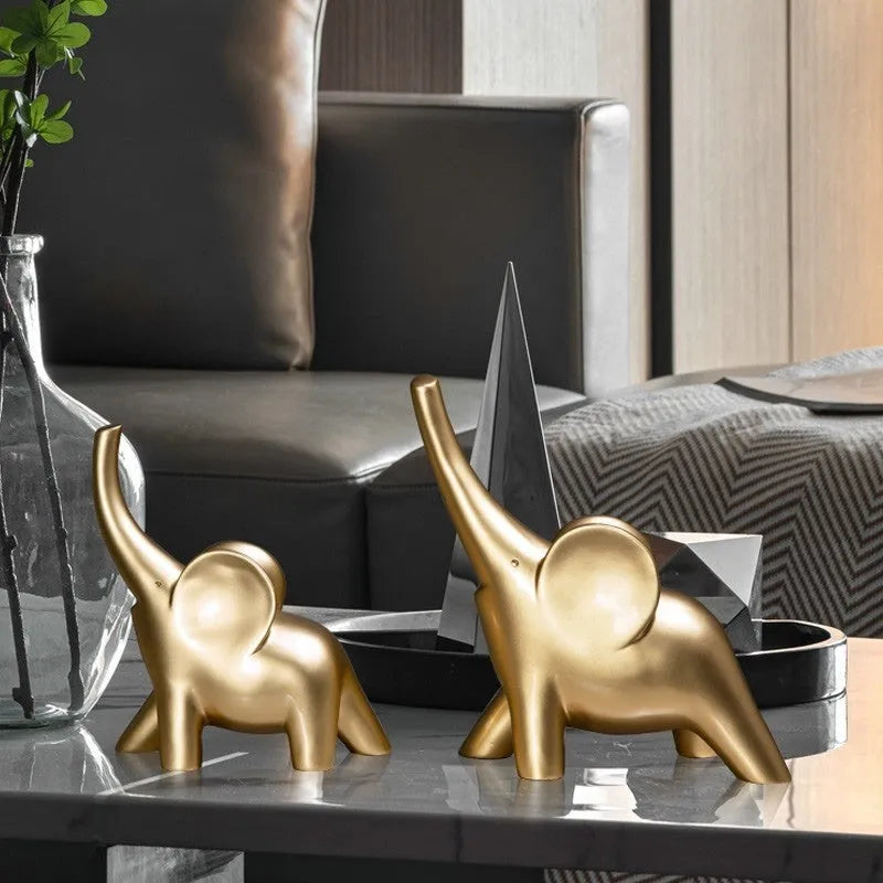 Modern resin and plastic elephant ornament in rose gold or white colour, available in large, small, or pair sizes.