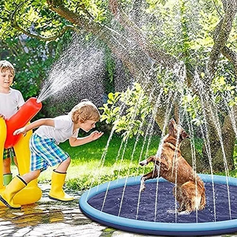 Large blue dog splash pad with textured anti-slip base on grass, with a dog playing in the shallow water.