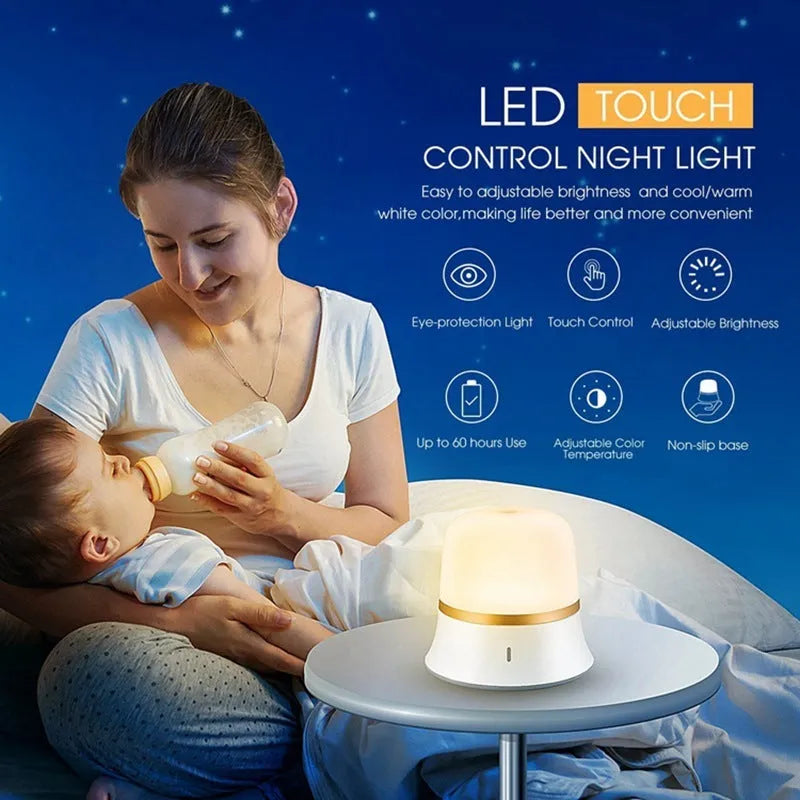 White bedside night light with touch controls for dimming and changing RGB colours on a table.