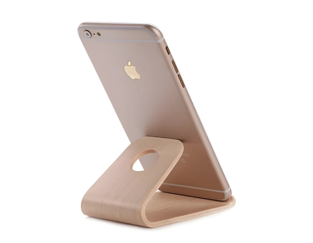 Minimalist wooden iPhone stand in walnut or white maple finish with a cable notch.