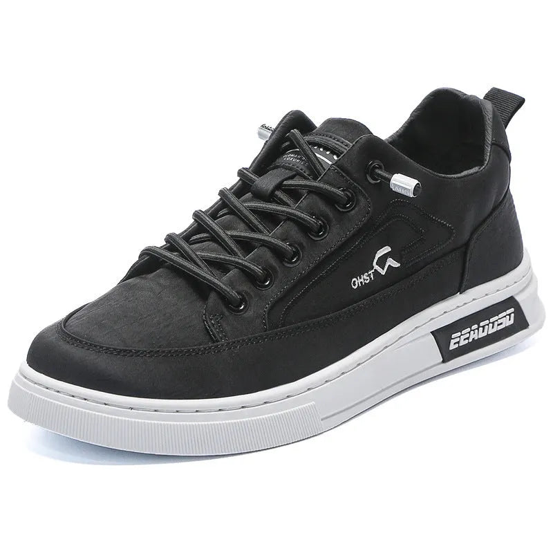 Grey men's low-top canvas casual sneakers with lace-up front and round toe on a rubber sole.