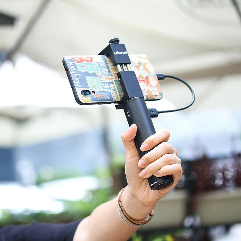 Black aluminium alloy portable power bank with a carry handle, showing its compact size.