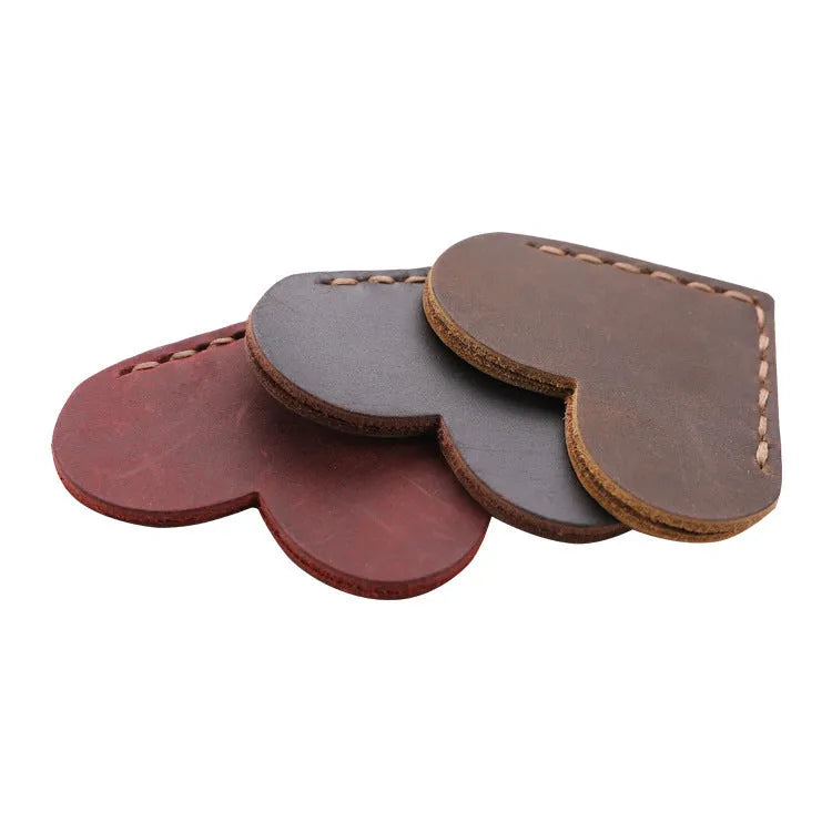 Heart-shaped bookmark in brown crazy horse leather with textured surface and handmade edges