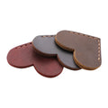 Heart-shaped bookmark in brown crazy horse leather with textured surface and handmade edges
