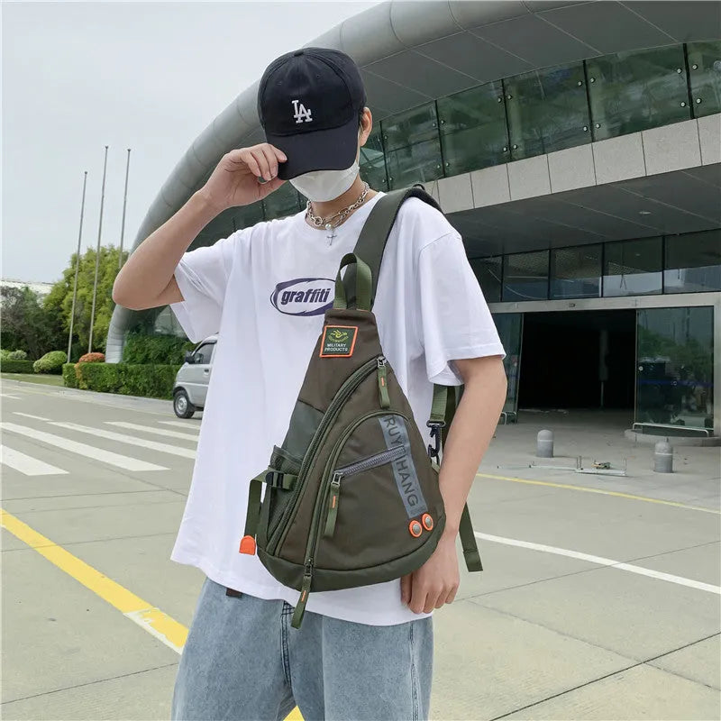 Unisex outdoor large capacity nylon chest bag in black with ventilation slots and adjustable strap