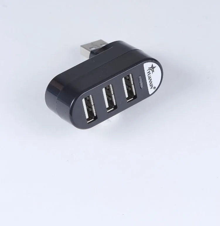 Black and white USB hub splitter with multiple USB 2.0 ports for computer expansion