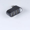 Black and white USB hub splitter with multiple USB 2.0 ports for computer expansion