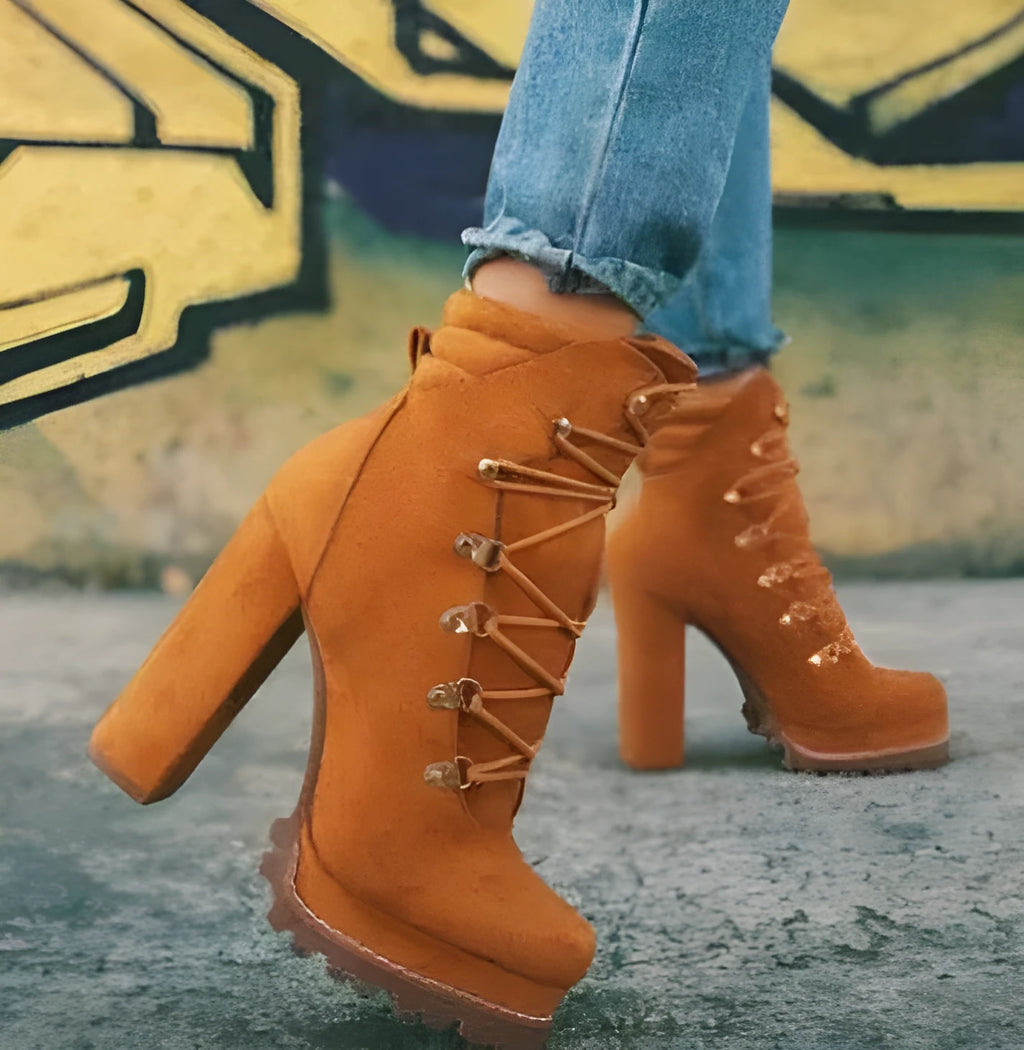 Women's suede high heel ankle boots with thick block heel in army green, showing round toe and belt buckle detail.