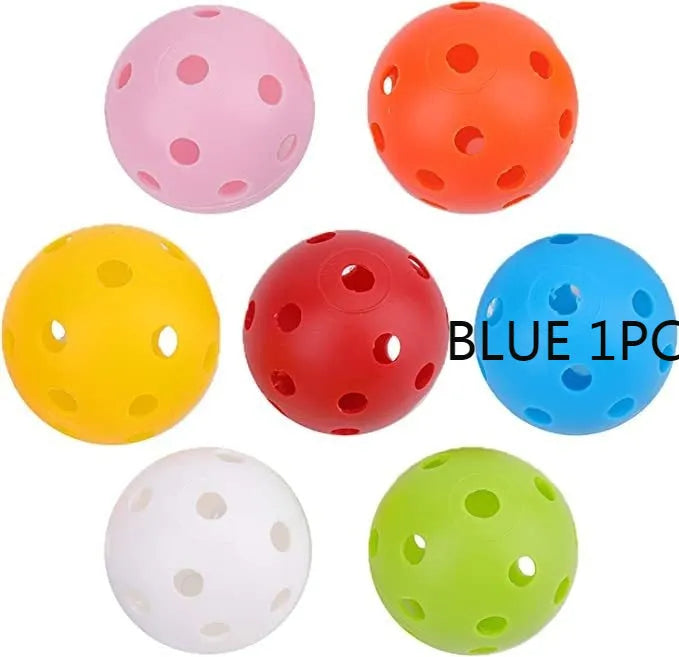 Multi-coloured golf practice balls in net storage pocket for putting training