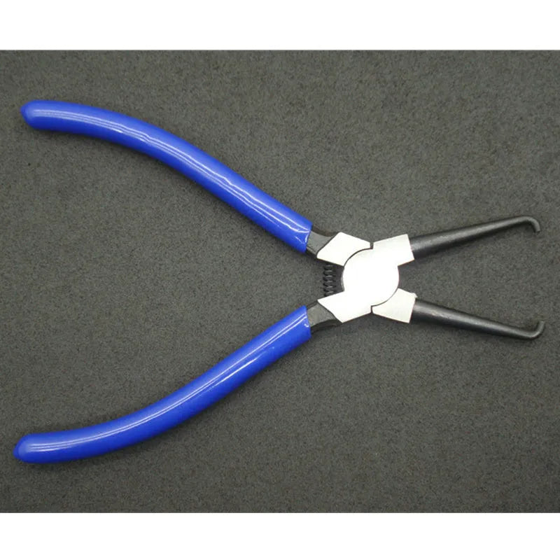Caliper tubing pliers with iron construction and rubber-coated jaws for automotive fuel line connector work.