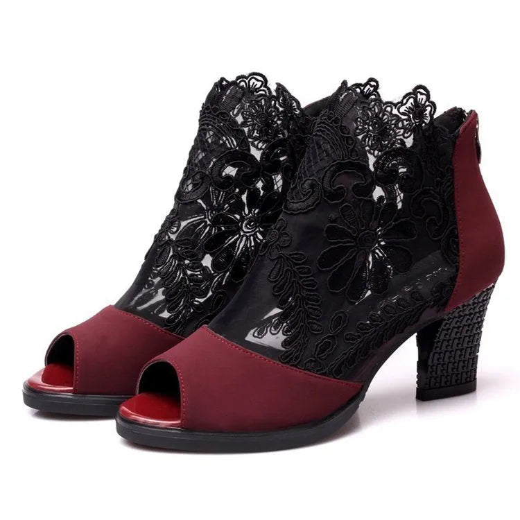 Black women's gladiator sandals with lace upper, square heel, zip closure, and peep toe.