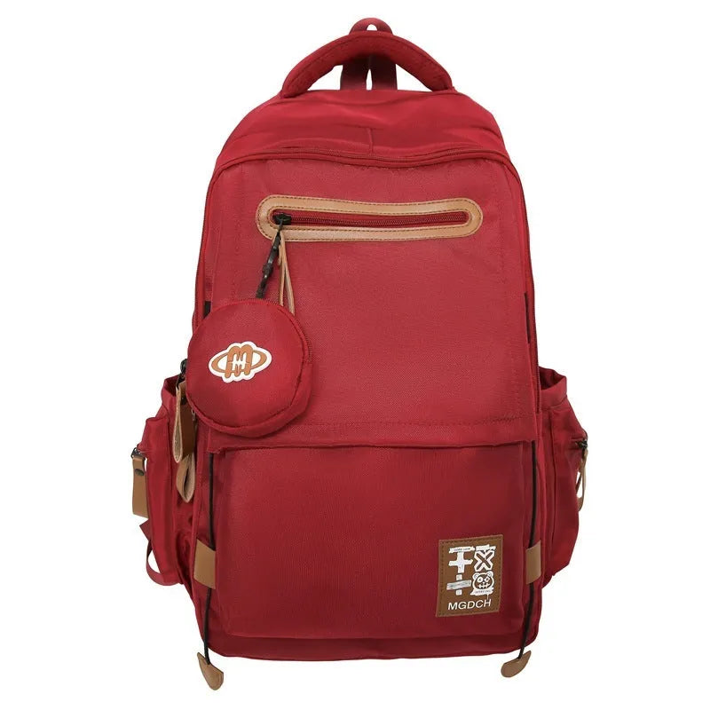 Large-capacity nylon backpack for middle school students with curved shoulder straps in multiple colours