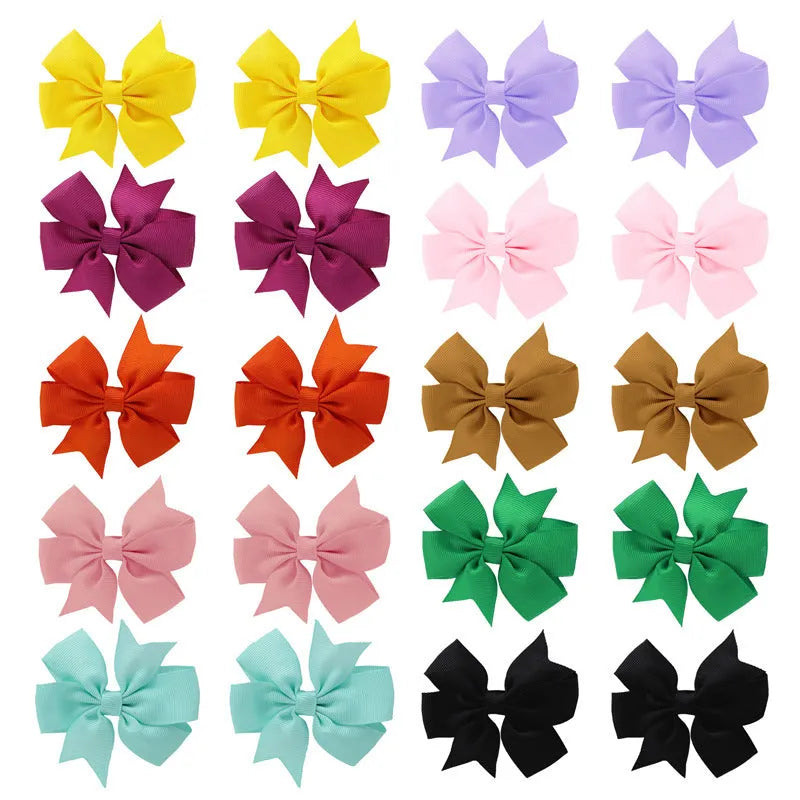 Assorted 3 inch grosgrain ribbon baby hair bows with alligator clips in multiple colours
