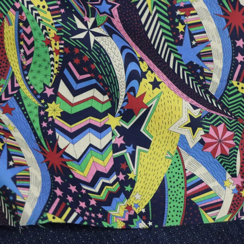 Blue cotton fabric with plant and flower digital print showing 145cm width measurement