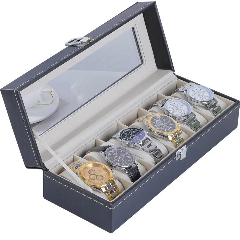 Grey leather watch storage box with clear dustproof lid showing multiple watch slots inside.