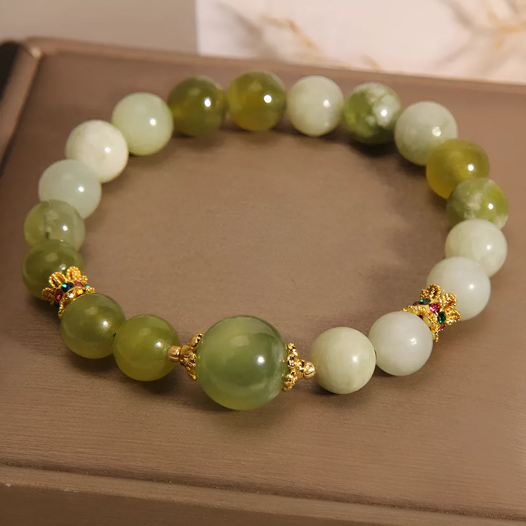 Women's Xiuyan jade bracelet in jade green with an original sweet mori style design.