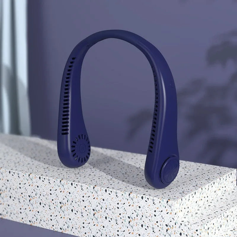 White bladeless neck fan hanging around neck with USB charging cable
