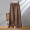 Women's straight-leg casual trousers with elastic waist and lace-up drawstring detail in polyester fabric