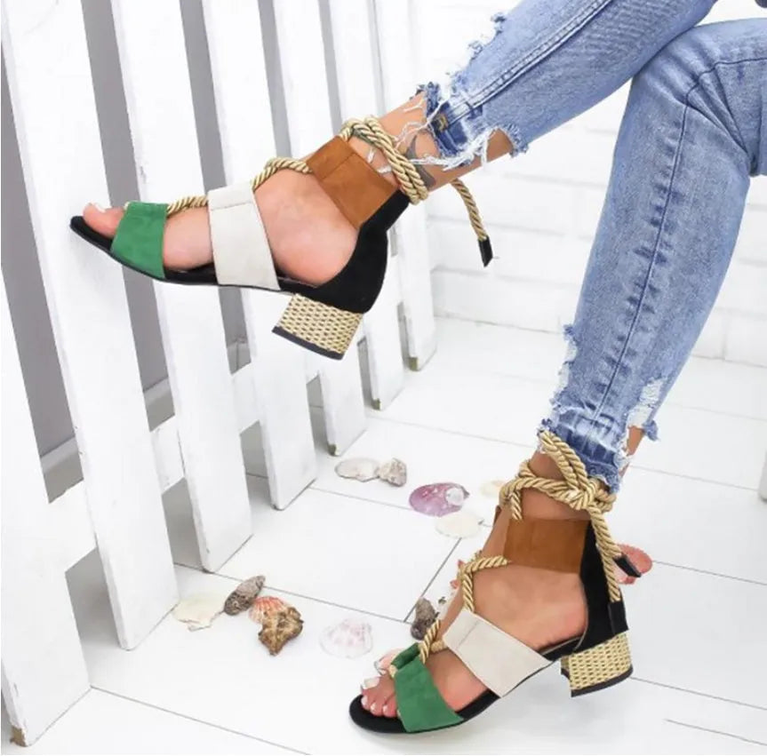 Women's beige suede sandals with thick heel and front strap.