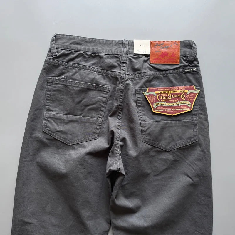 Men's straight-leg cotton trousers in grey, Army Green, and khaki colours on a mid-waist fit model.