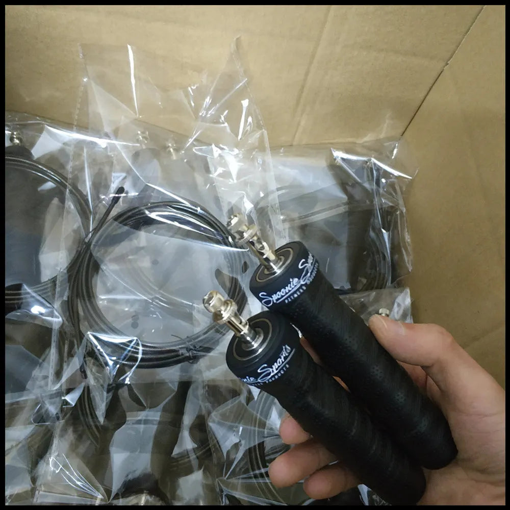 Jump rope with black PP handle, PU sweat belt, PVC wire rope on blue background