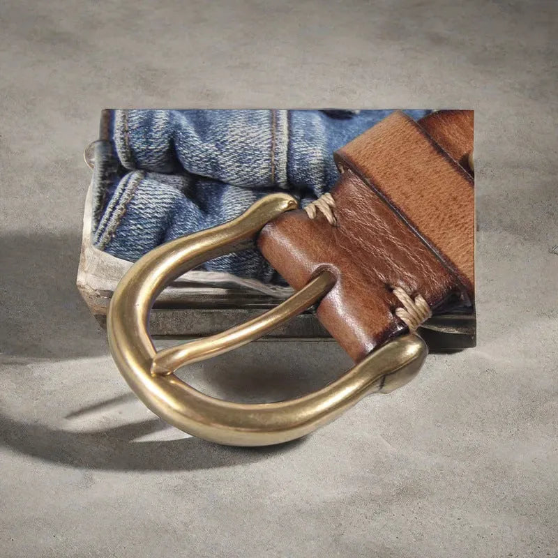 Men's brown cowhide leather casual belt with copper pin buckle on a flat surface