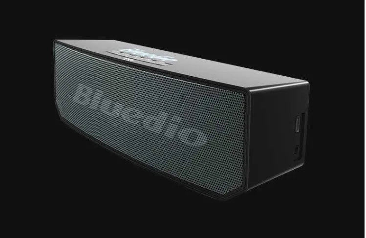 Black BS-6 cloud smart speaker with compact rectangular design on a surface.