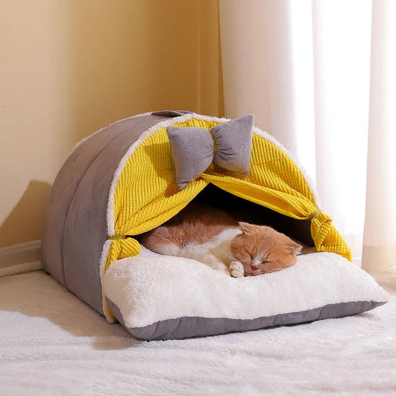 Semi-enclosed cat nest in creamy yellow cloth with grey mat, suitable for all-season indoor use