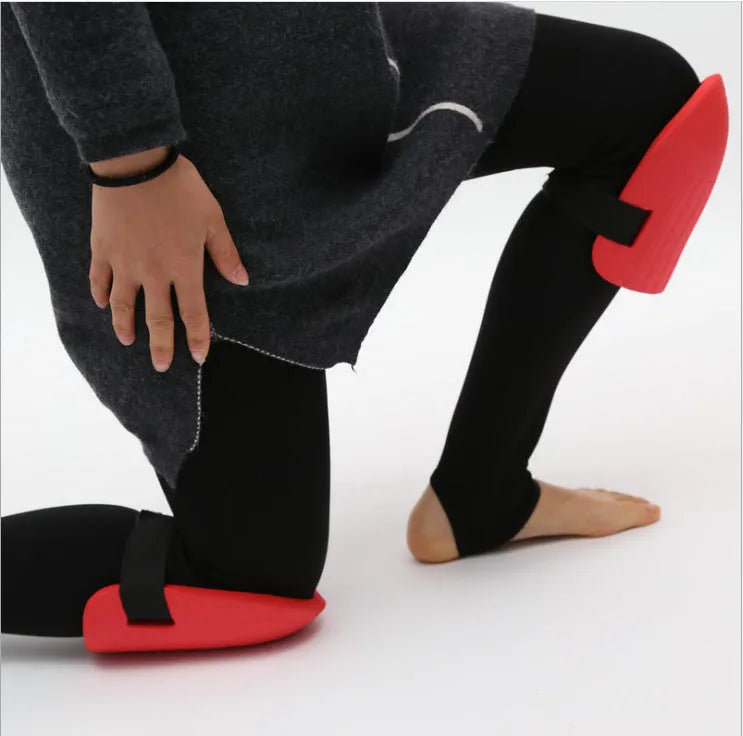 A pair of dense black EVA foam knee pads for gardening, showing size and thickness.