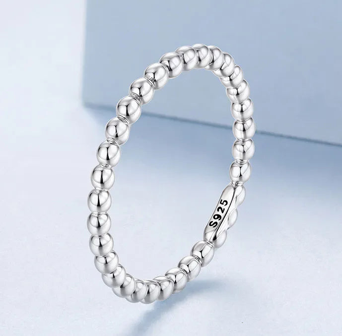 Silver bead ring with geometric shape and polka dot detail, stackable women's ring in sizes 6, 7, and 8.