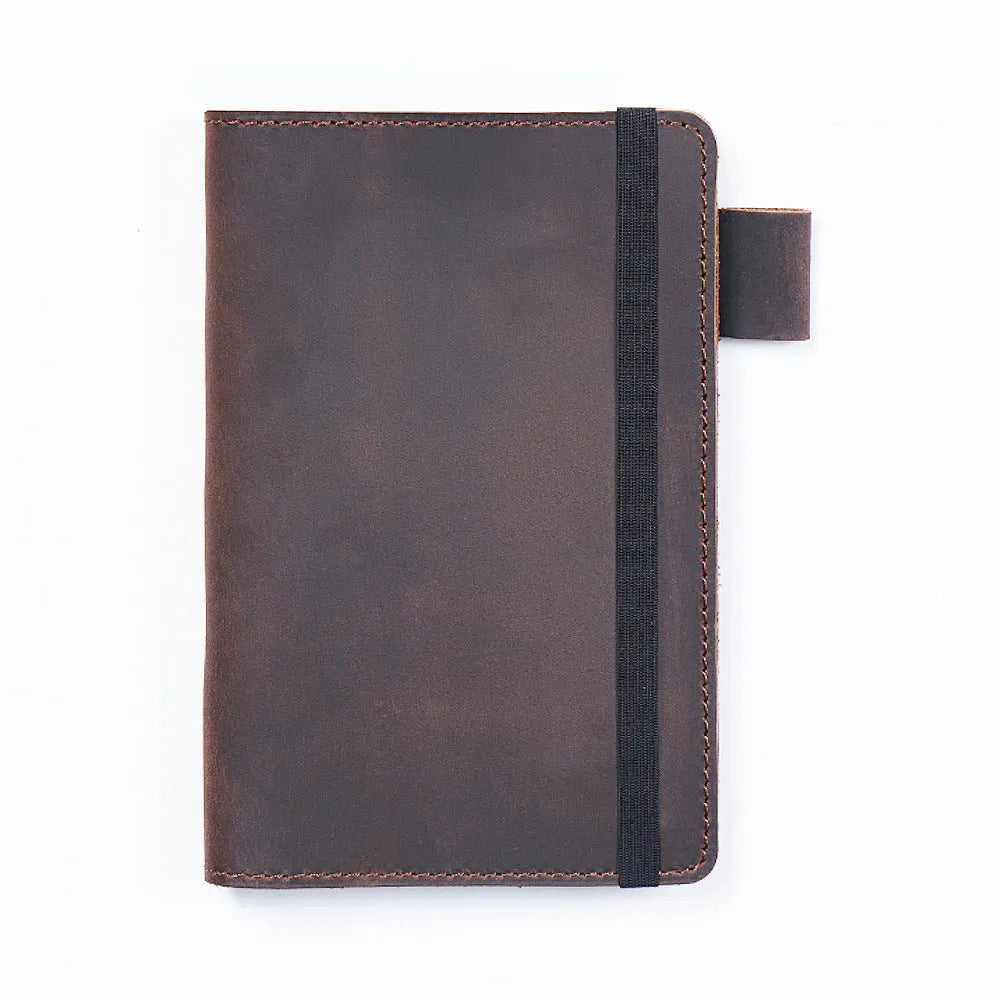 Handmade kraft notebook with cowhide cover in choice of six colours, showing open pages of wood-free paper.