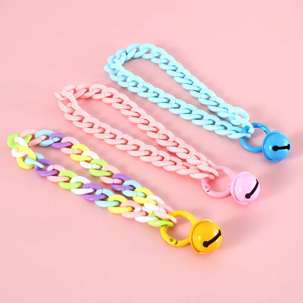 Macaron candy colour plastic pet collar on white background showing chain blue, pink and mixed colour options