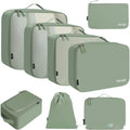 Set of eight cubic packing cubes for travel organisation in various colours including beige, black, and pink leopard print.