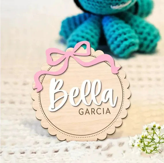 Square wooden baby room ornament personalised with a child's name in two available sizes.