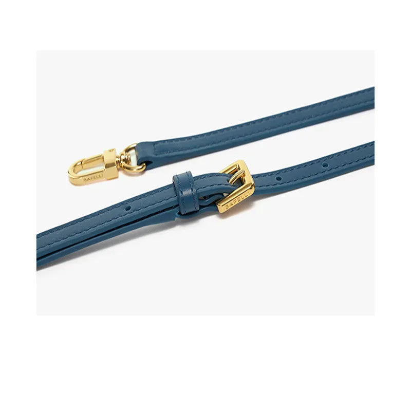 A women's cow leather wing-shaped handbag with a latch closure and a single shoulder strap.