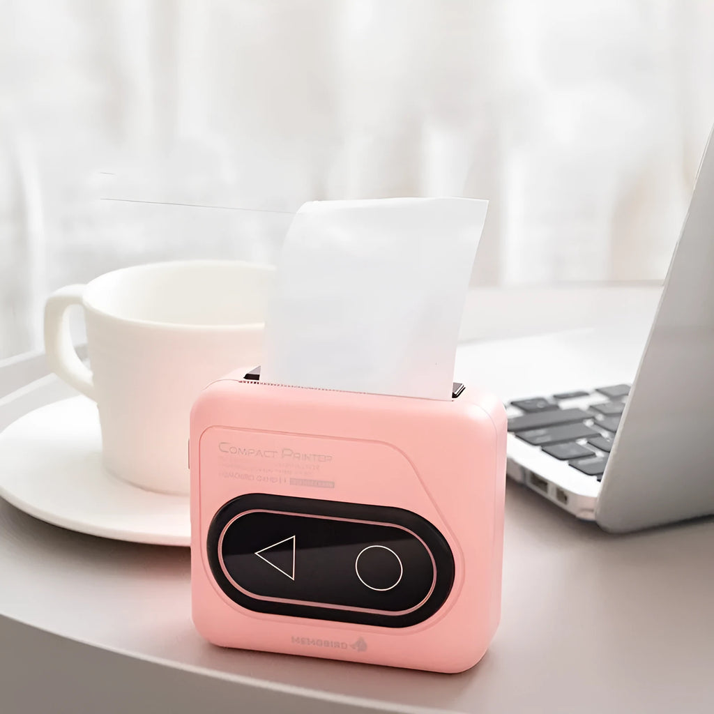 Portable Bluetooth mini thermal printer in avocado green with mobile phone showing wireless connection