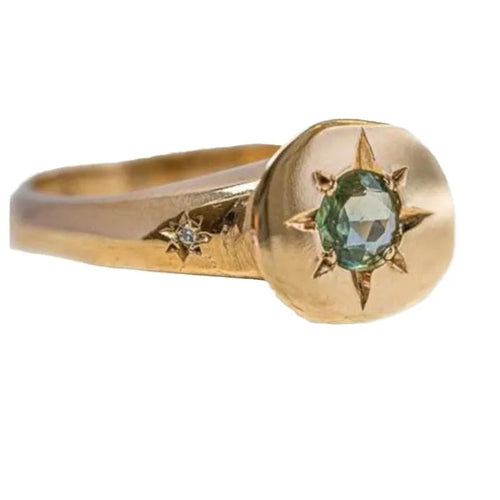 Golden adjustable ring with star design and oval asterism zircon setting