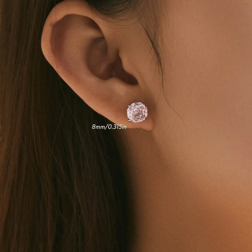 A pair of S925 sterling silver stud earrings featuring a detailed rose flower design, shown in two size options.