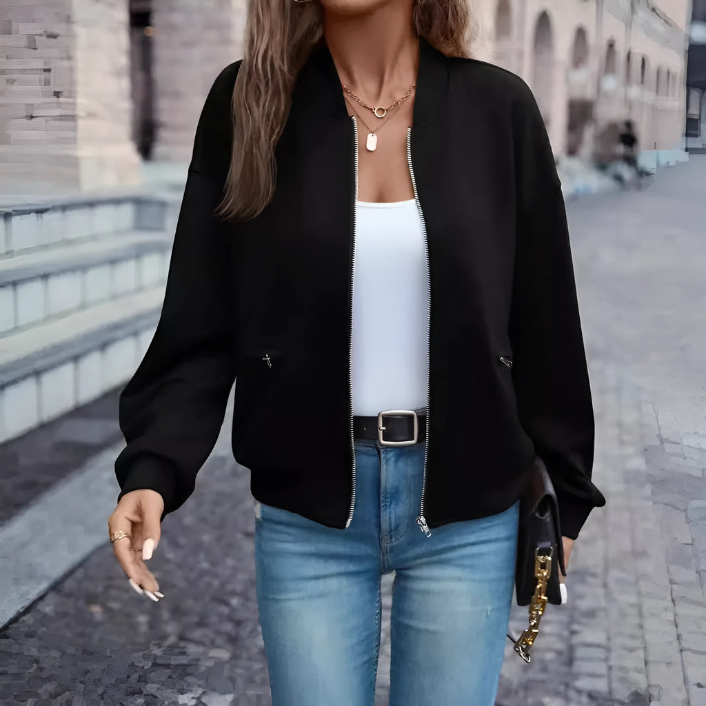 Black women's casual zip jacket with long sleeves and faux pocket detail