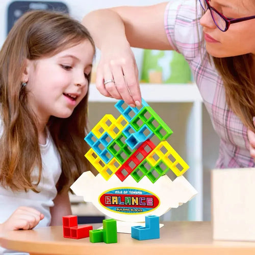 Plastic balance stacking game with 16 colourful building blocks on chassis