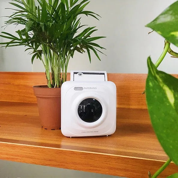 Paperang mini thermal printer in white with Bluetooth connectivity and compact 83x83x45mm size