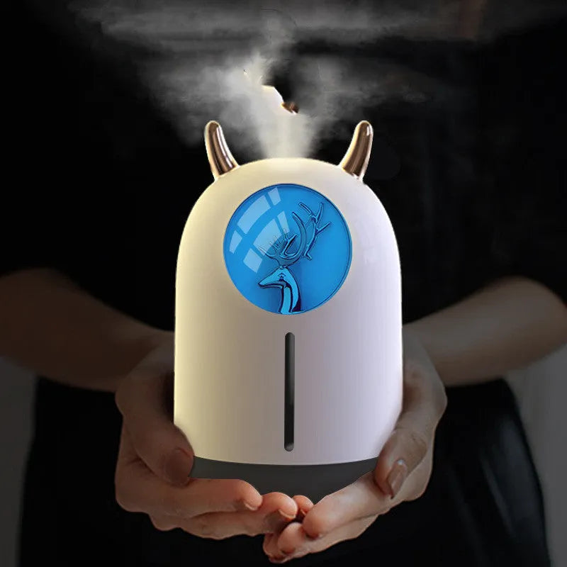 Mini animal-shaped USB aroma diffuser humidifier in white or pink with single mist outlet for small spaces