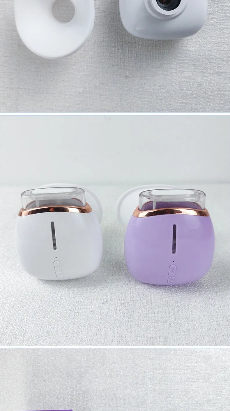 White and purple portable eye humidifier with USB charging cable and instruction manual