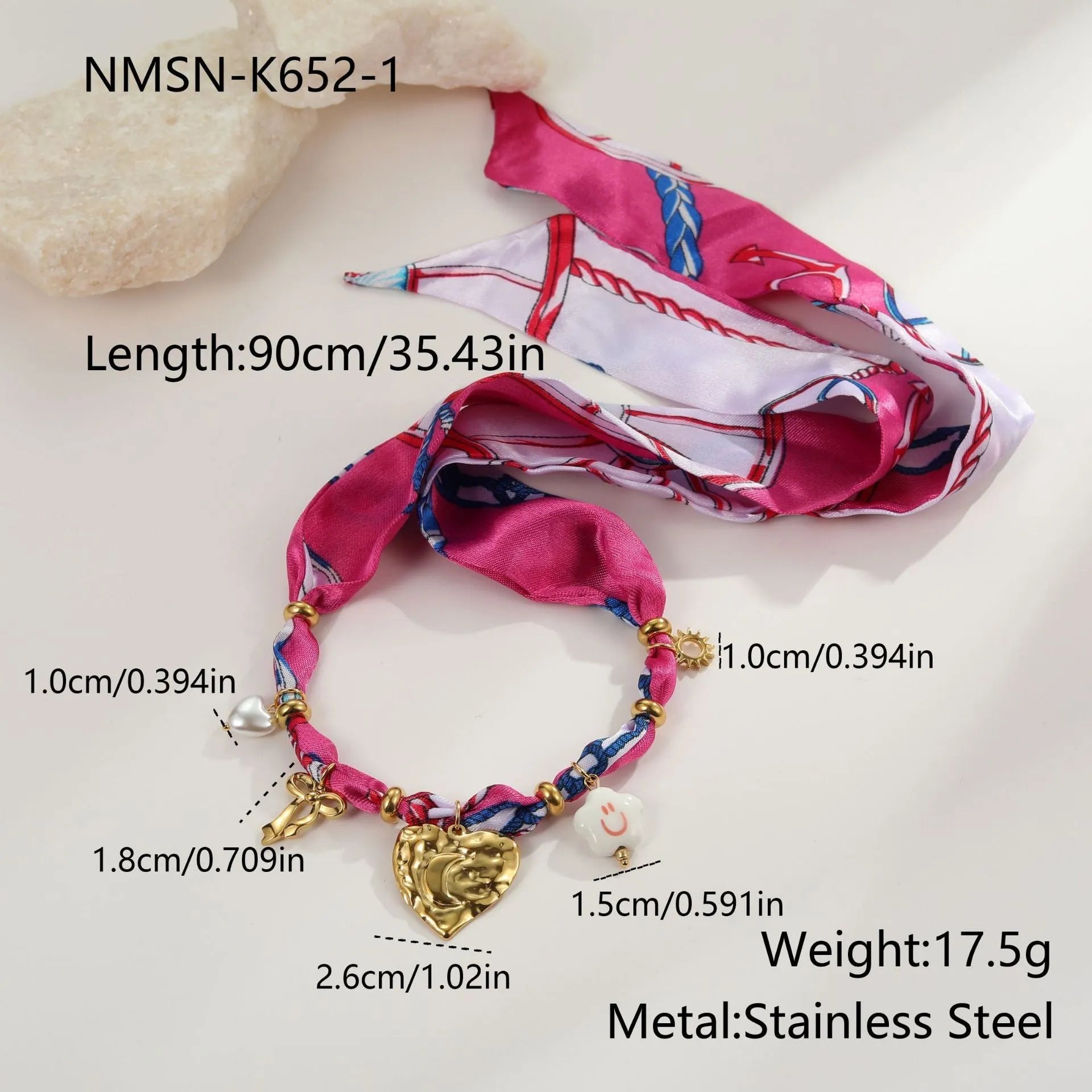 Stainless steel necklace and bracelet set with geometric pendant and gold electroplated finish.