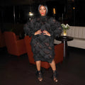 Black chiffon fringe loose mid-length dress with stand collar and long sleeves on a model