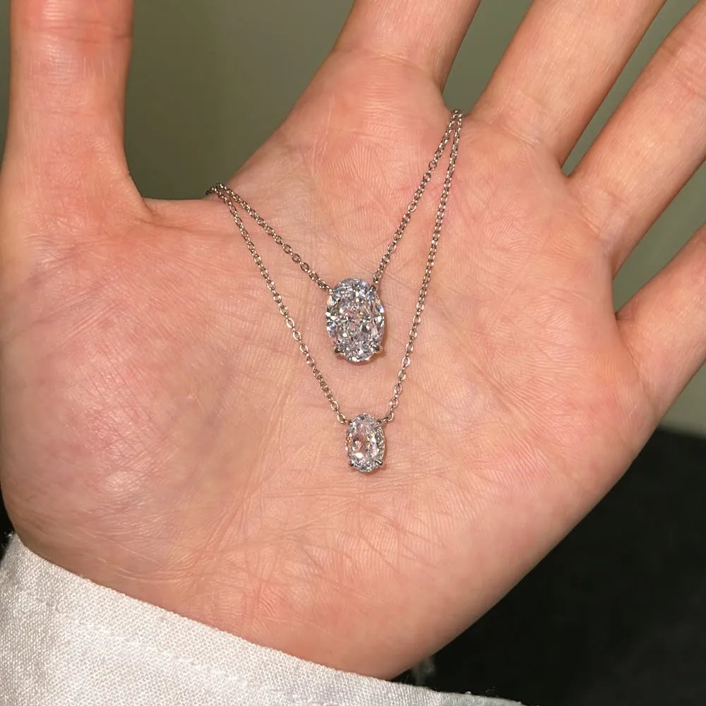 S925 sterling silver necklace with a geometric oval ice flower pendant in gold or platinum finish.