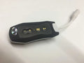 Compact black waterproof MP3 player for swimming with a connected earphone.